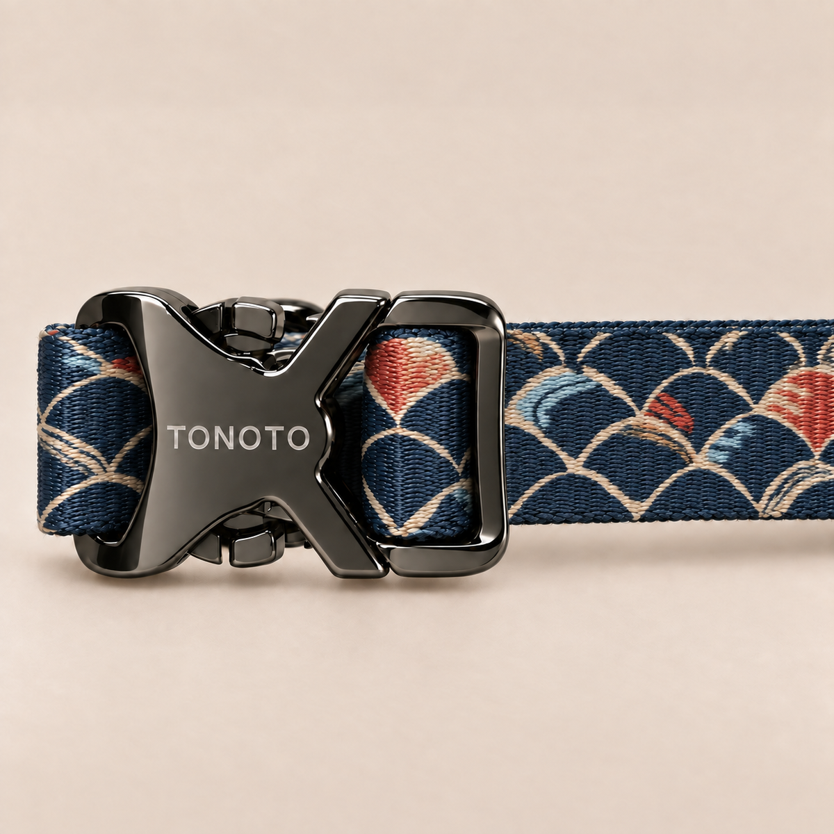 Close-up of TONOTO buckle on koi pattern collar