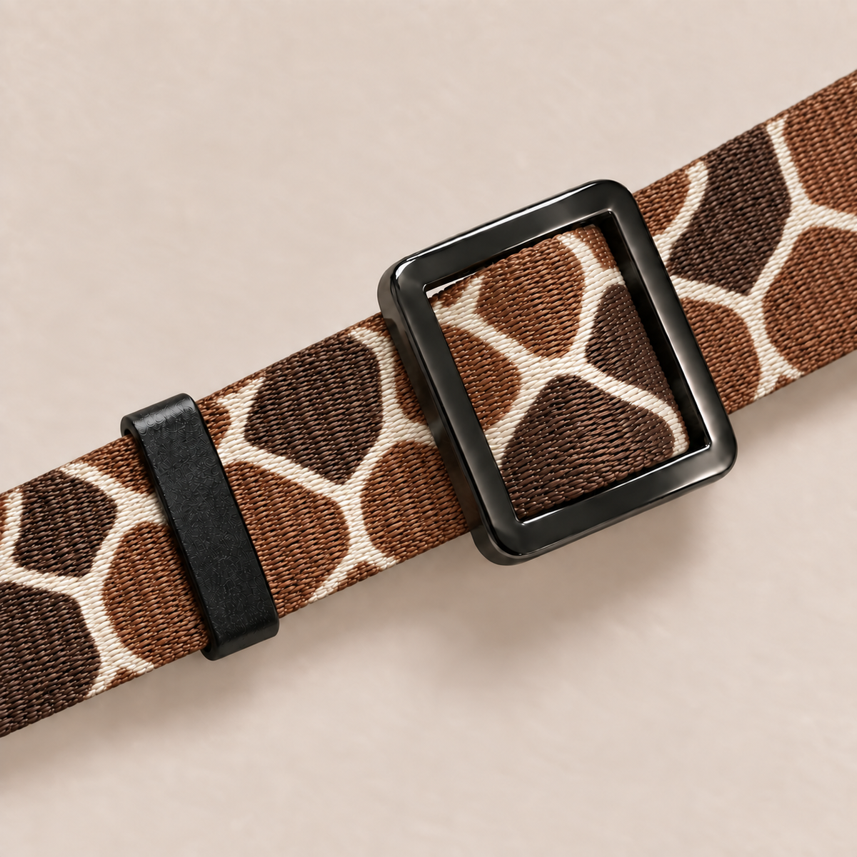 Close-up of adjustable slider on giraffe pattern collar