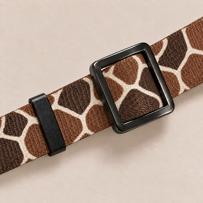 Close-up of adjustable slider on giraffe pattern collar