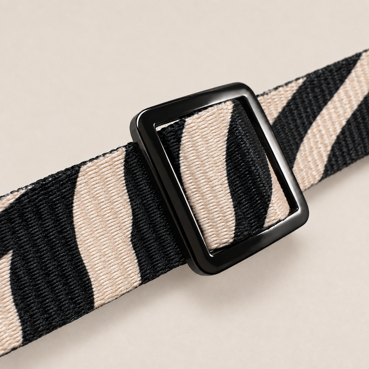 Close-up of adjustable slider on zebra pattern collar