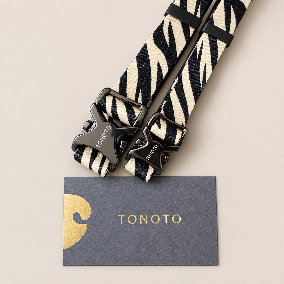 Close-up of zebra pattern lead and TONOTO tag