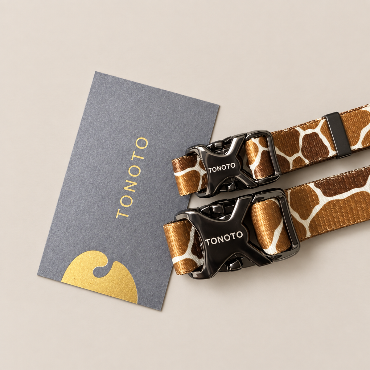 Close-up of giraffe pattern collar buckle and TONOTO tag