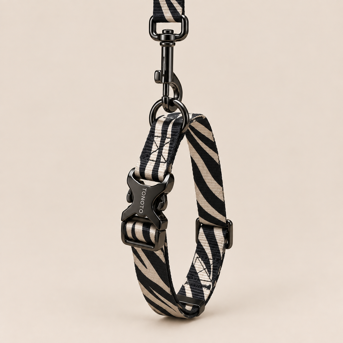 Zebra pattern dog collar attached to lead
